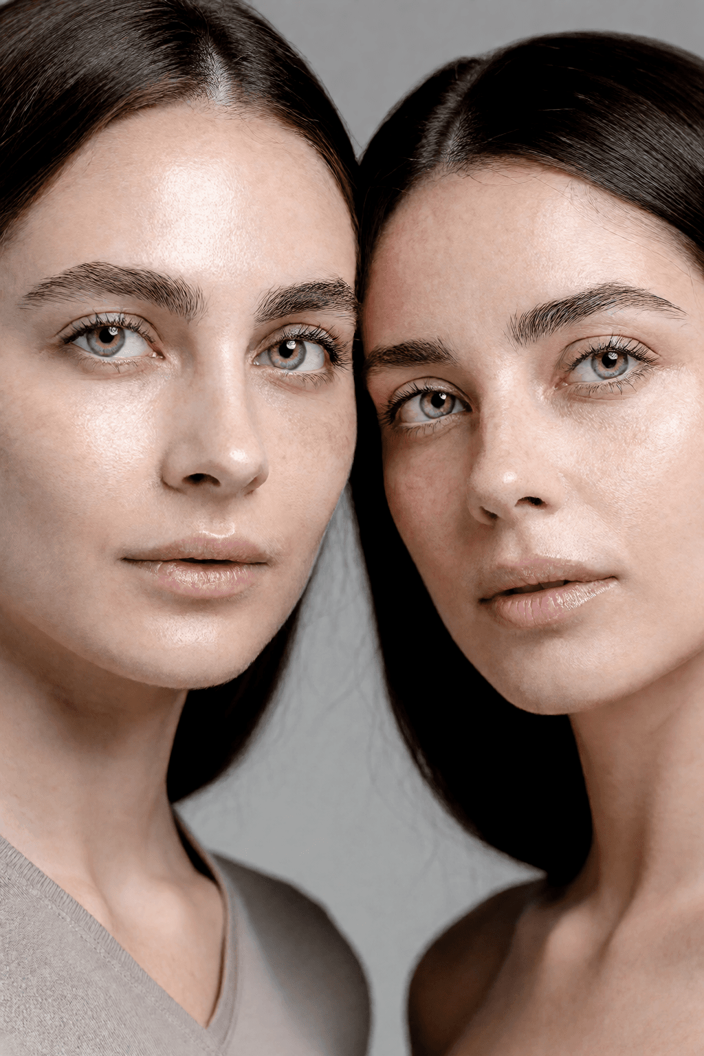 Two subjects at once: Out of distribution. Both faces keep their own texture instead of averaging toward one shared complexion.